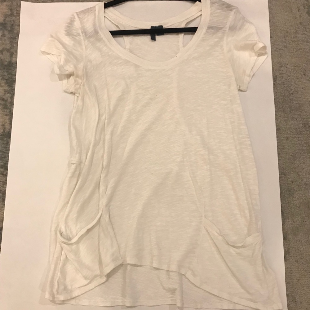 White tee with open slits in the back